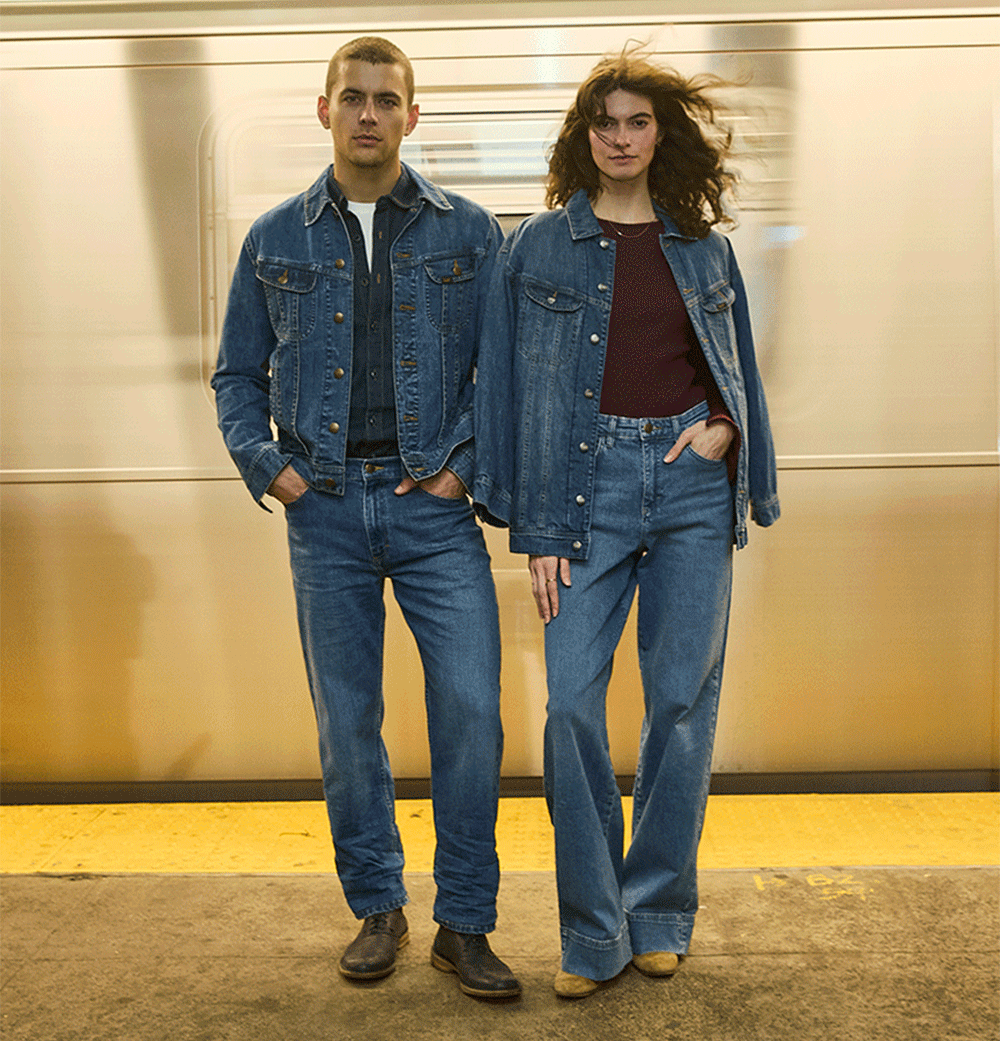 Couple in the subway wearing the Iconic. Essential Rider Jacket.