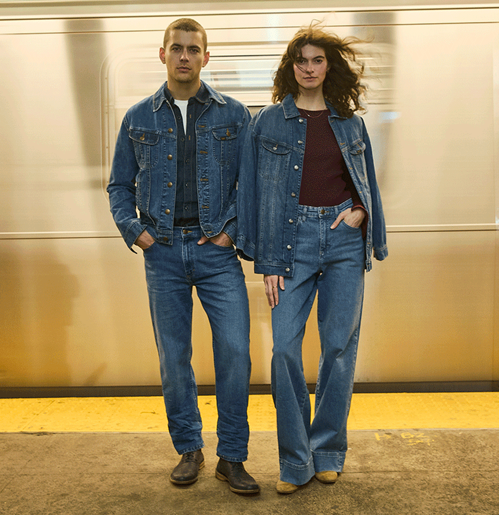 Couple in the subway wearing the Iconic. Essential Rider Jacket.