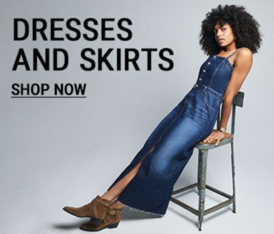 shop dresses and skirts woman wearing dress sitting in chair