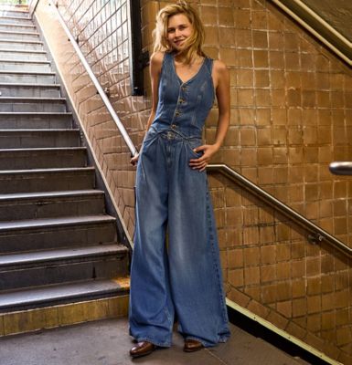 Woman walking down subway steps wearing Lee LQD Denim.