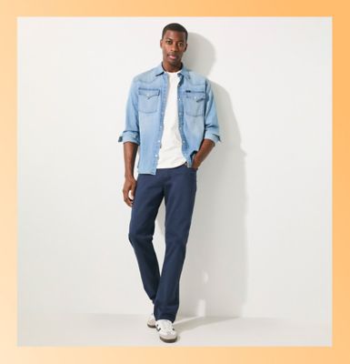 wearing Men's Regular Straight Twill Pant standing against a wall.