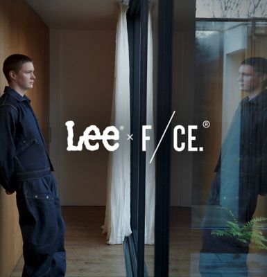 Man Standing in front of window wearing Lee 101 x F/CE. Collab gear.