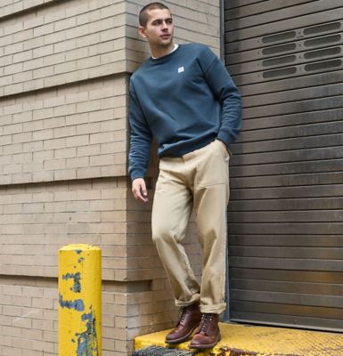 Guy at loading dock in city wearing Lee utility pants.