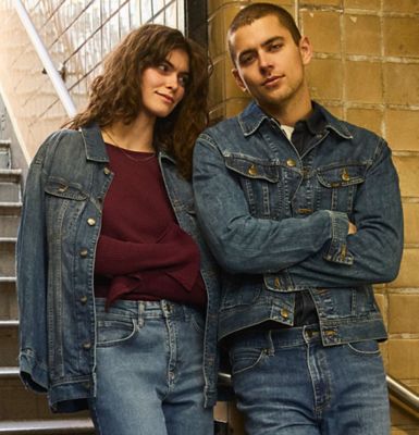 Couple in the subway wearing Lee Rider Jackets.